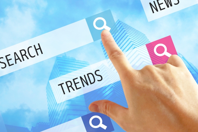 TRENDSの文字列と人の手